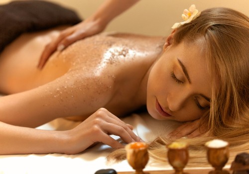 A beautiful woman getting a salt scrub in a spa