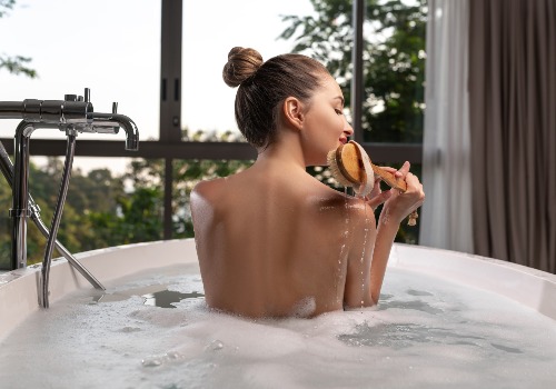 A woman takes a bath in a luxury apartment