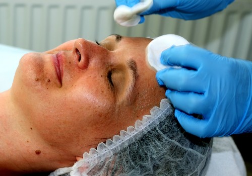A woman treating skin pigmentation in a salon