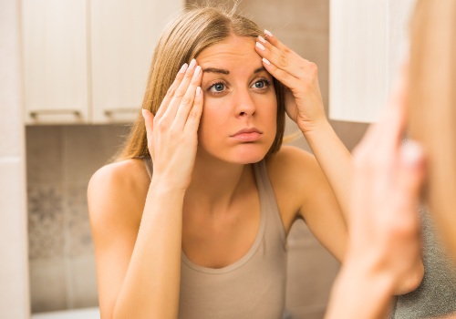 Woman uses forehead muscle